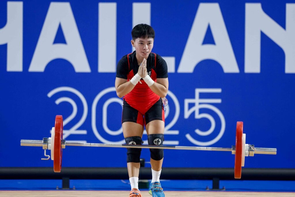 Rosegie Ramos reacts after failing to complete her lifts in the women’s 48kg at the SEA Games. [POC Media Pool]