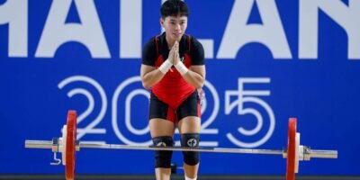 Rosegie Ramos reacts after failing to complete her lifts in the women’s 48kg at the SEA Games. [POC Media Pool]