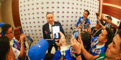 POC president Abraham Tolentino discusses last-minute changes to the delegation lineup. [POC Media pool]