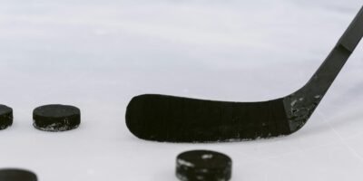 hockey representation image [Photo by Tima Miroshnichenko from Pexels: https://www.pexels.com/photo/close-up-shot-of-a-hockey-puck-and-hockey-stick-6847470/]