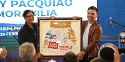 Manny Pacquiao hands over his fight trunks to President Ferdinand Marcos Jr. at the Philippine Sports Museum. [PSC photo]