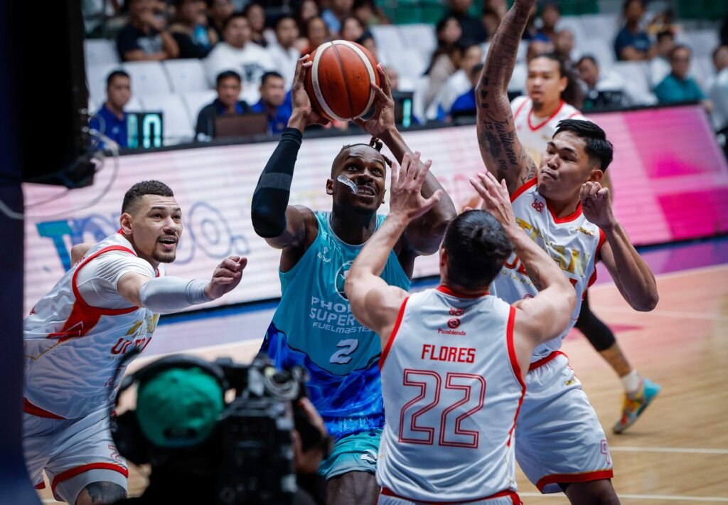 James Dickey battles inside the paint while delivering a double-double performance for Phoenix. [PBA Images]