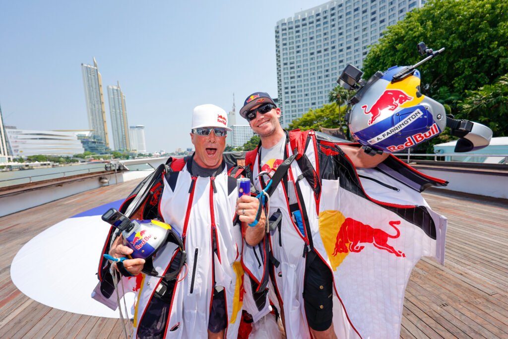 Miles Daisher (Left) and Andy Farrington celebrate the successful wingsuit above First-Ever Wingsuit Flight in BANGKOK, THAILAND [photo credit: Yosayoot Wiengviset / Red Bull Content Pool]