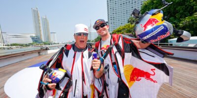 Miles Daisher (Left) and Andy Farrington celebrate the successful wingsuit above First-Ever Wingsuit Flight in BANGKOK, THAILAND [photo credit: Yosayoot Wiengviset / Red Bull Content Pool]