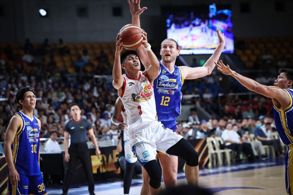 Gian Mamuyac drives to the basket during Rain or Shine’s win over Magnolia in the PBA Commissioner’s Cup. [PBA Images]