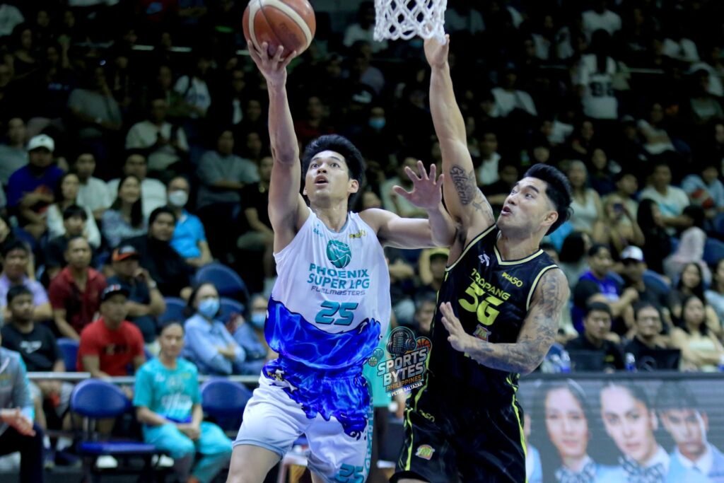 Ricci Rivero drives to the basket before exiting with a finger injury. [photo credit: Peter Baltazar]