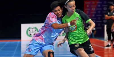 Beach Hut's Jodie Banzon (right) barrels past ADC's Dai Dolino in a pivotal moment in the PFF Futsaliga Women's semis where she was able to issue the assist to Samantha Toledo for the win and finals ticket. [Futsaliga photo]