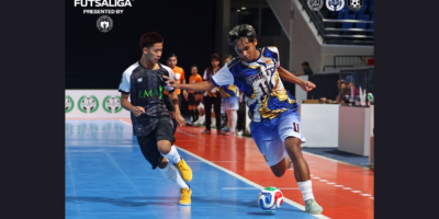 PFF Futsaliga U17 Boys' MVP Franc Obias (right) of Star FC runs past EMA Bulacan Highlanders' Jhon Kyle Balcos (left) in the finals. [Futsaliga photo]