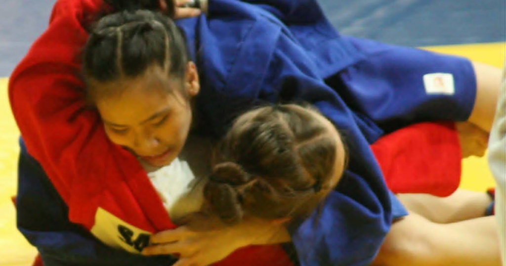 Sophia Nicole Divino pins E. Samatova of Kyrgyzstan during their Youth women’s -47kg preliminary bout at the 11th Asia-Oceania Sambo Championships at Ninoy Aquino Stadium. [PSC photo]