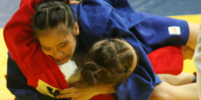 Sophia Nicole Divino pins E. Samatova of Kyrgyzstan during their Youth women’s -47kg preliminary bout at the 11th Asia-Oceania Sambo Championships at Ninoy Aquino Stadium. [PSC photo]