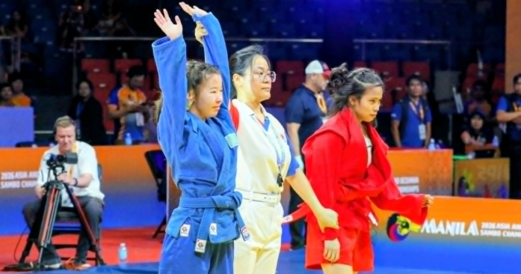 Kazakhstan's Karakat Rakhybay raises her hands in victory after beating Filipina grappler women's youth -47-kilogram division of the 11th Asia-Oceania Championships at the Ninoy Aquino Stadium last Wednesday evening. [PSC photo]