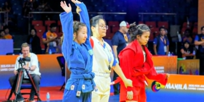 Kazakhstan's Karakat Rakhybay raises her hands in victory after beating Filipina grappler women's youth -47-kilogram division of the 11th Asia-Oceania Championships at the Ninoy Aquino Stadium last Wednesday evening. [PSC photo]