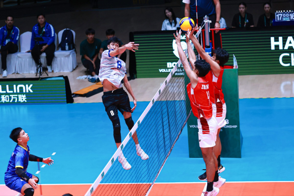 The Philippines' Terrence Marticion powers a kill past two Indonesian blockers as libero Clarenz Altoveros looks on during their AVC match. [Photo: AVC]