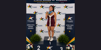 Crystal Saphire Embol poses with her gold medals at the State Games of America. [State Games of West Virginia Facebook]