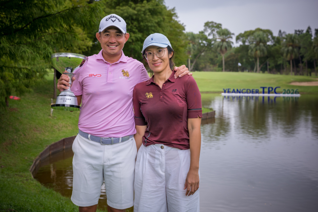 Pavit Tangkamolprasert celebrates his milestone Yeangder TPC victory with his wife, Chorphaka Jaengjit. [Asian Tour photo]