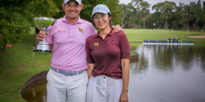 Pavit Tangkamolprasert celebrates his milestone Yeangder TPC victory with his wife, Chorphaka Jaengjit. [Asian Tour photo]